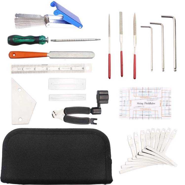 Guitar string changing tool set laid out: blue winder, red picks, wrenches, ruler