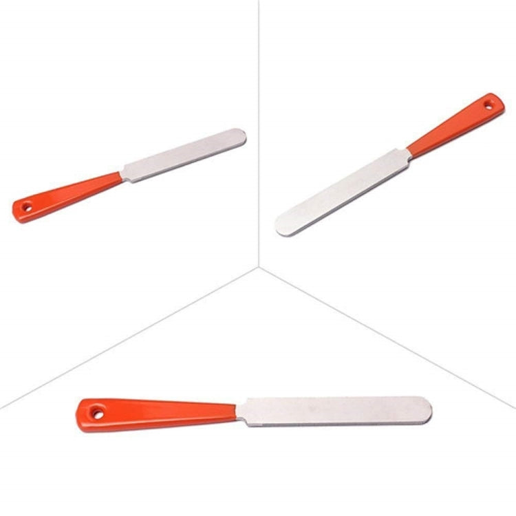 Orange-and-silver string puller/spreader tool with flat metal blades