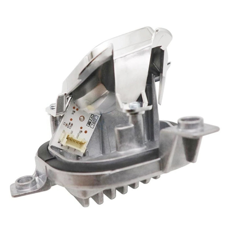 LED turn signal light module showing internal circuit board and metal support bracket