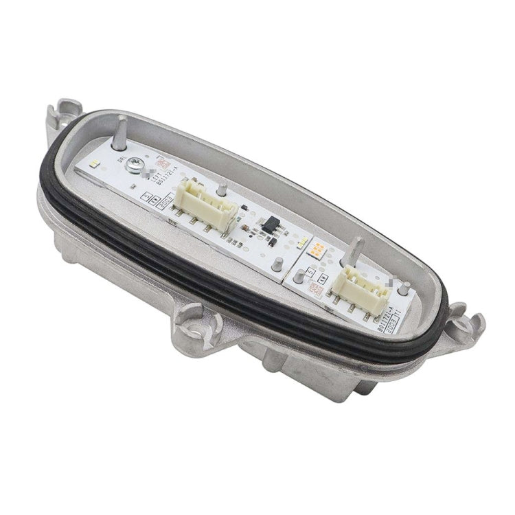 Left LED turn signal ballast control module, side view with electronics on PCB