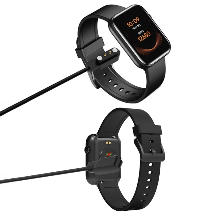 Black magnetic charging cable attached to a smartwatch at its charging contacts