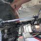 Hex wrench extender conversion adapter installed in a vehicle engine bay