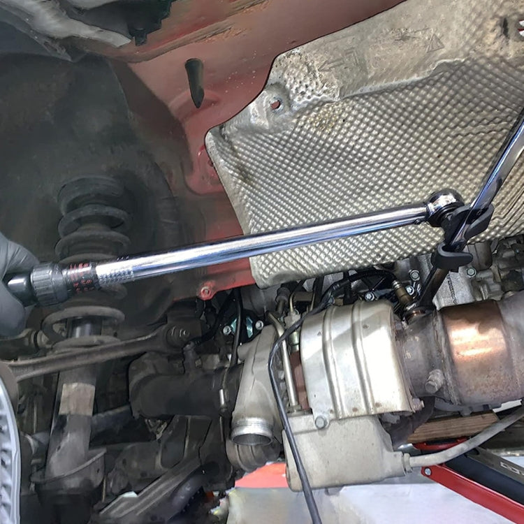 Hex wrench extender conversion adapter installed in a vehicle engine bay
