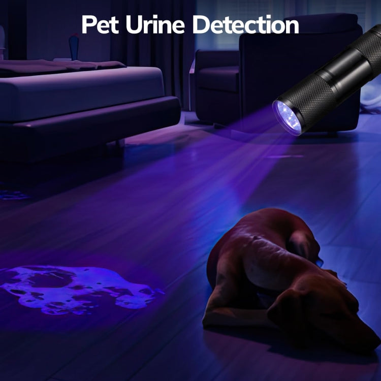 Black UV flashlight emitting a violet beam from the front lens
