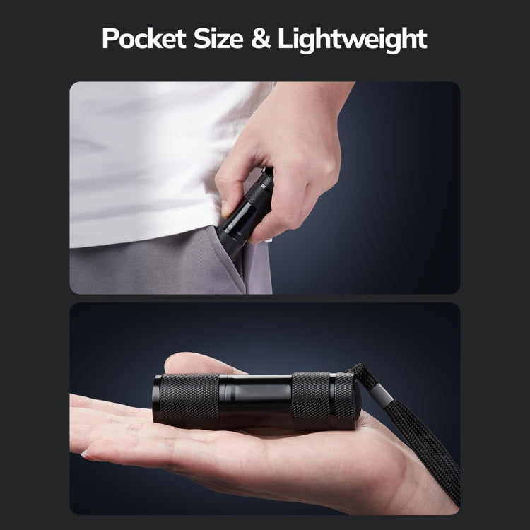 Black textured UV flashlight held in hand, compact pocket-size cylinder