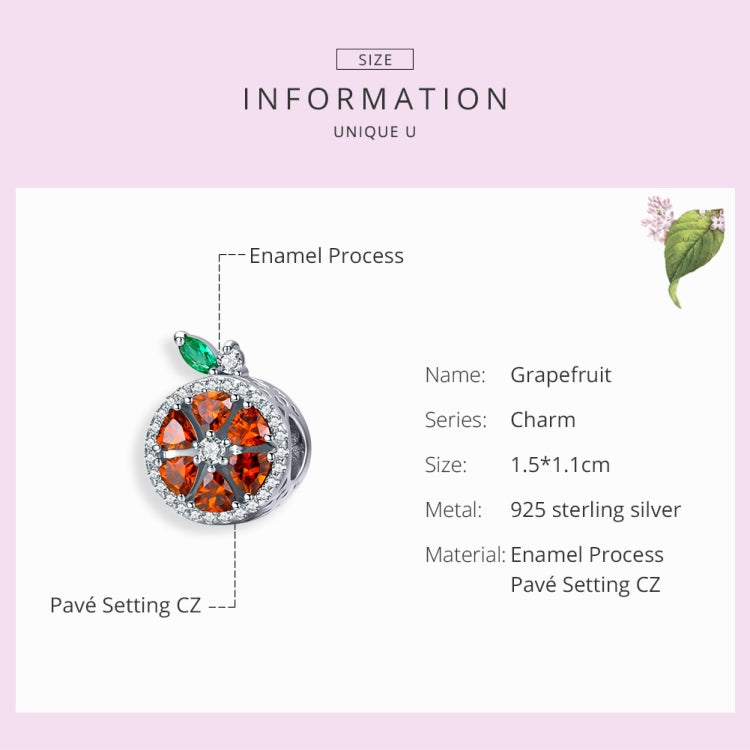 Sterling silver grapefruit charm with orange enamel and green leaf detail
