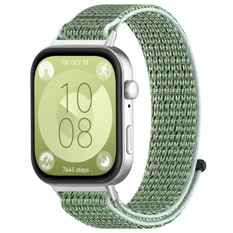 Nylon hook-and-loop watch band in sage green, shown attached to a smartwatch