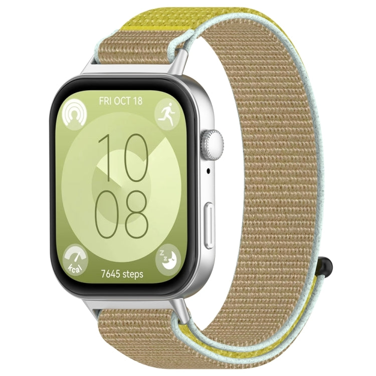 Tan nylon hook-and-loop watch band with pale blue and yellow edging, attached to a smartwatch