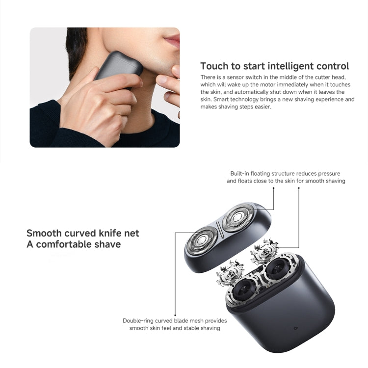 Dark grey electric shaver with dual round foil heads, shown with hand near face