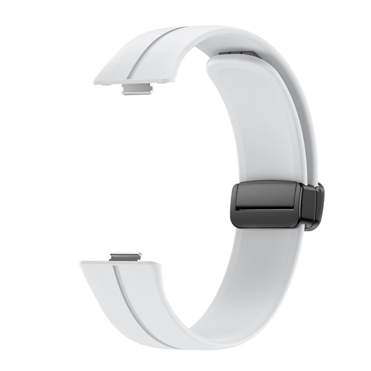 White silicone watch band with black magnetic buckle, shown unattached