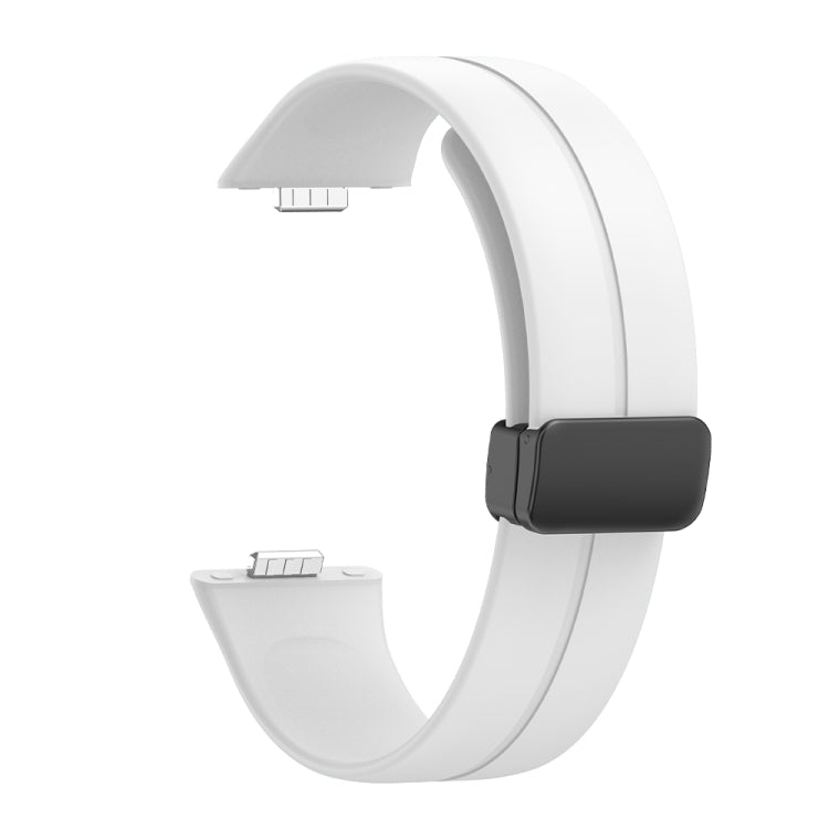 Reverse side of a white silicone watch band with black magnetic buckle