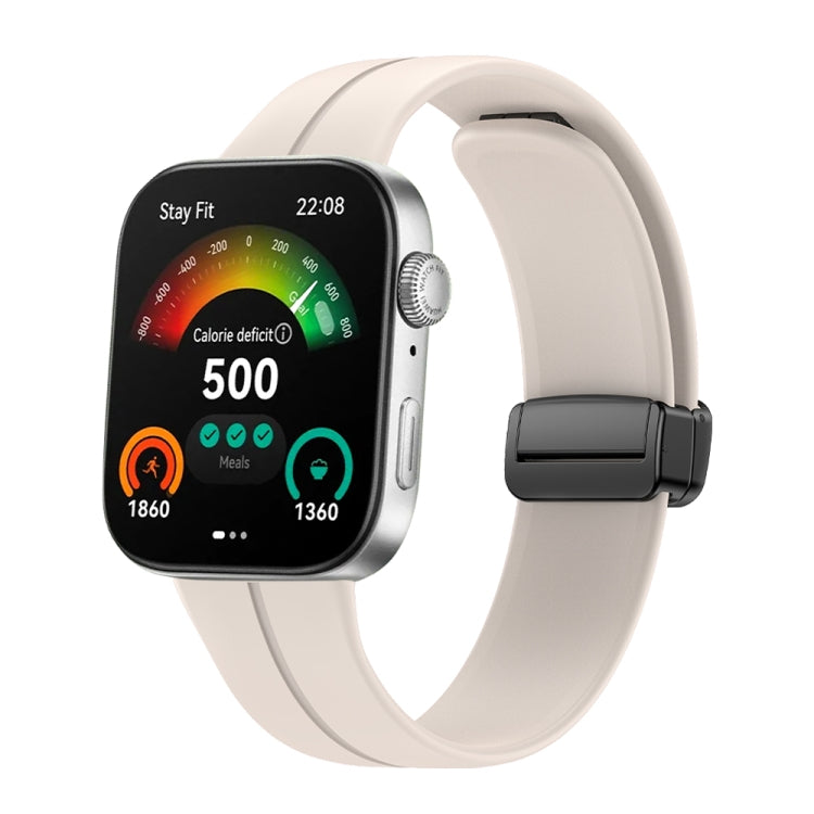 Cream silicone watch band with black magnetic buckle shown on a smartwatch
