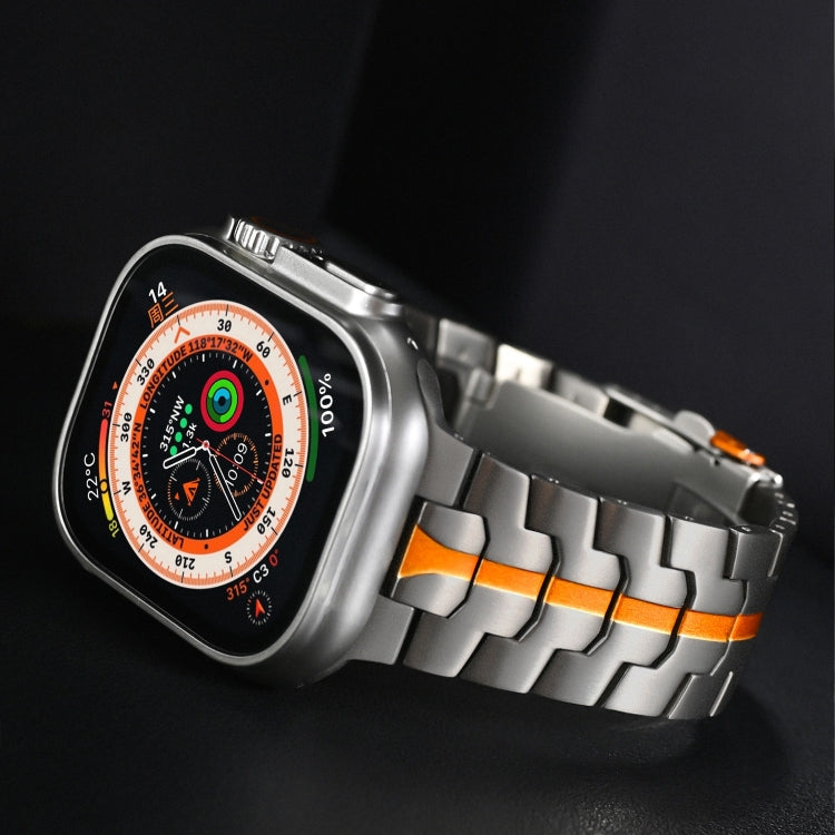 Titanium steel watch band with orange accents and a double-lock clasp, shown on a smartwatch