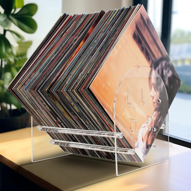 Acrylic record display stand close-up with stacked vinyl records in transparent frame