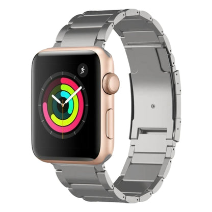 Silver titanium metal watch band attached to a rose-gold smartwatch, shown in a link bracelet style.