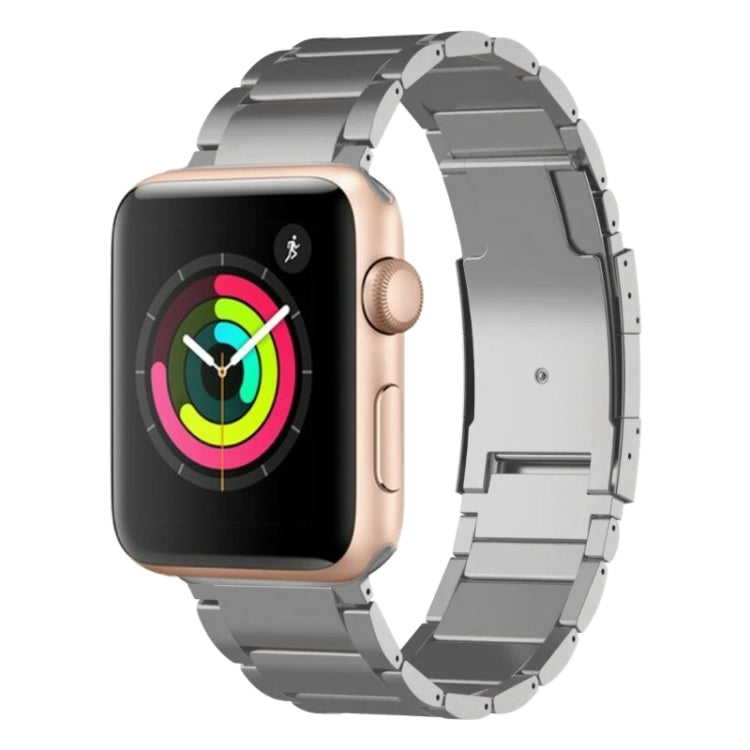 Silver metal watch band with adjustable links and a clasp, shown on a smartwatch.