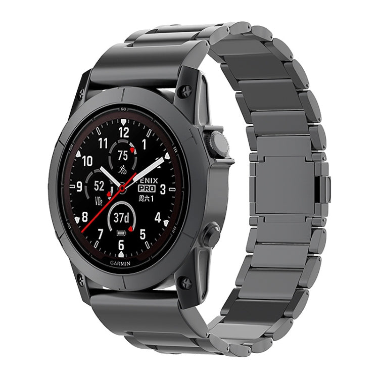 Dark gray metal quick-release watch band shown on a Garmin watch.