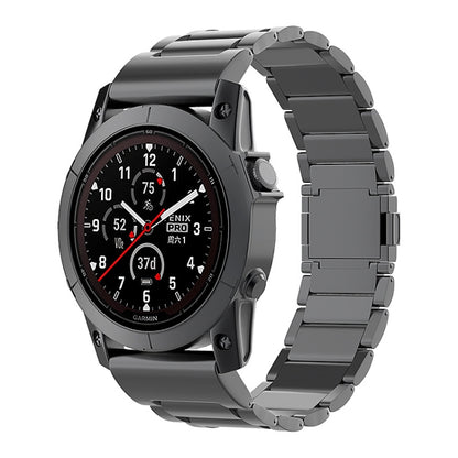 Dark gray metal quick-release watch band shown on a Garmin watch.