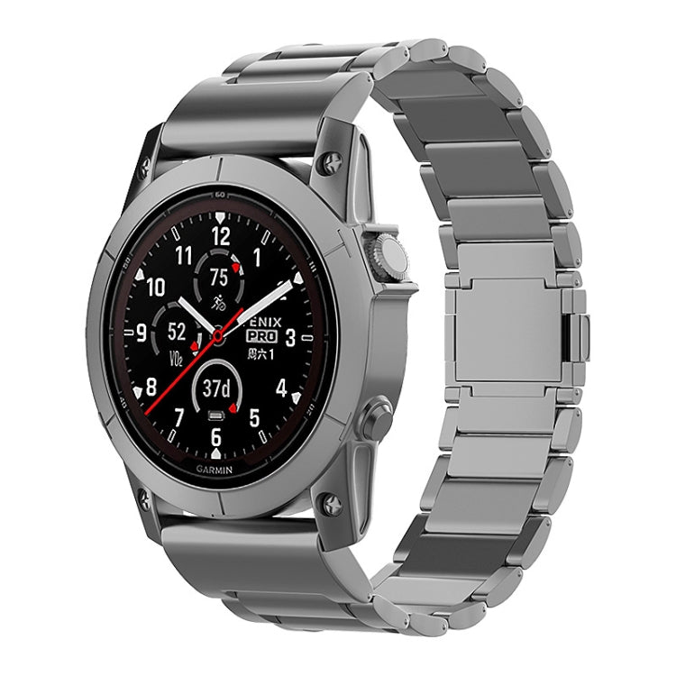 Gray metal quick-release watch band shown on a Garmin watch.