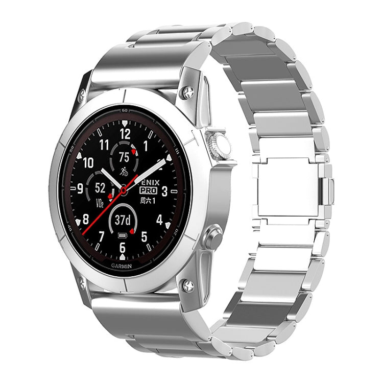 Silver metal quick-release watch band shown on a Garmin watch.