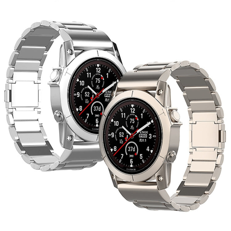 Silver and titanium-tone metal quick-release watch bands shown on Garmin watches.