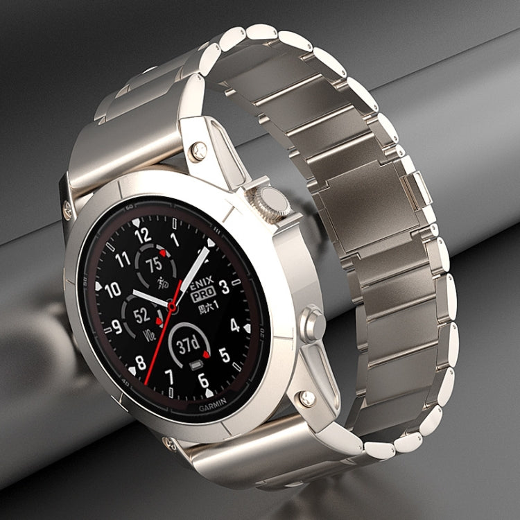 Silver metal quick-release watch band fitted to a Garmin watch.