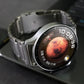 Silver titanium alloy watch band fitted to a smartwatch, shown from the side.
