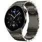 Dark gray metal link watch band fitted to a smartwatch
