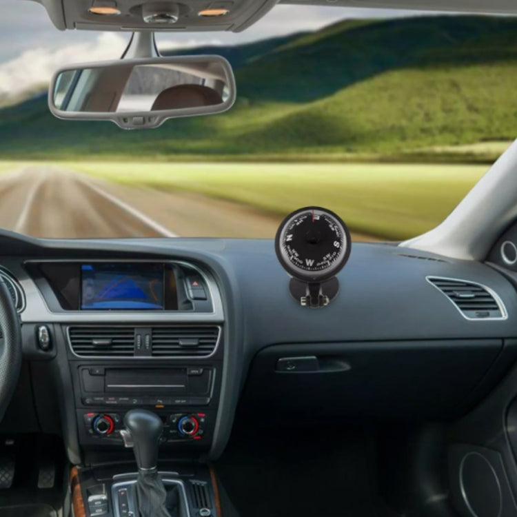 Black car compass ball mounted on dashboard