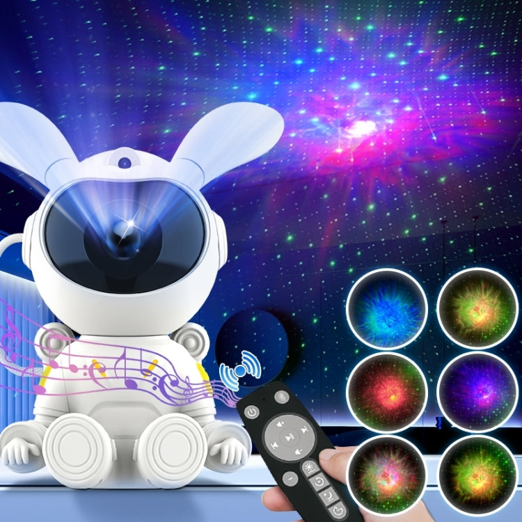 White space rabbit projection lamp casting colorful nebula lights with matching remote control