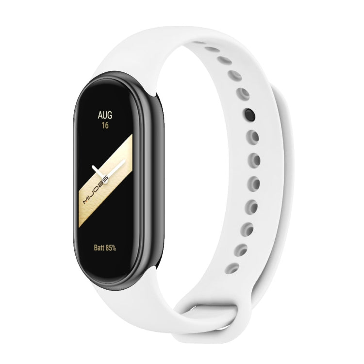 White silicone watch band with adjustable holes and metal buckle, shown with a fitness tracker