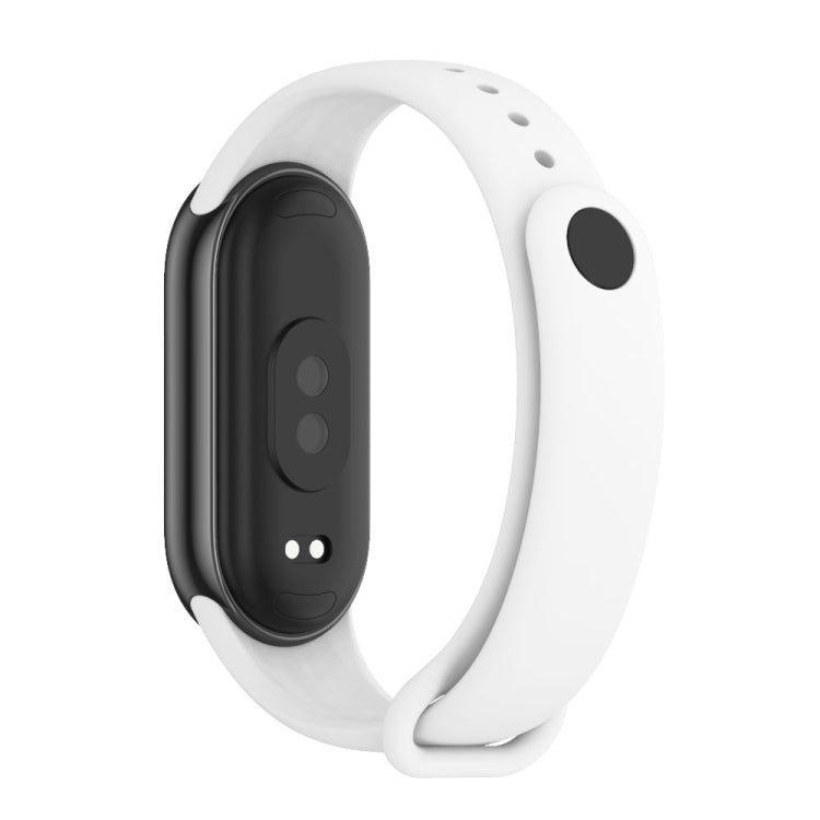 White silicone fitness tracker band shown from the underside with sensor and clasp