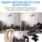 Black smart security camera beside a phone showing motion alert icons