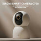 White smart security camera mounted on wall with black oval lens