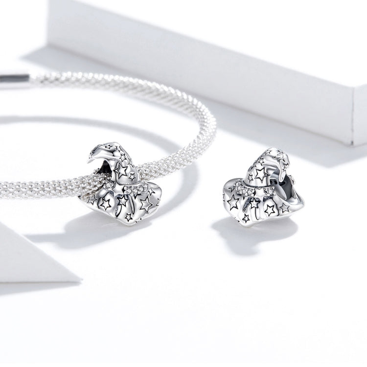 Silver bracelet with two witch hat charm beads with star cutouts