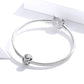 Sterling silver charm bracelet with two bead accents, one pavé-set