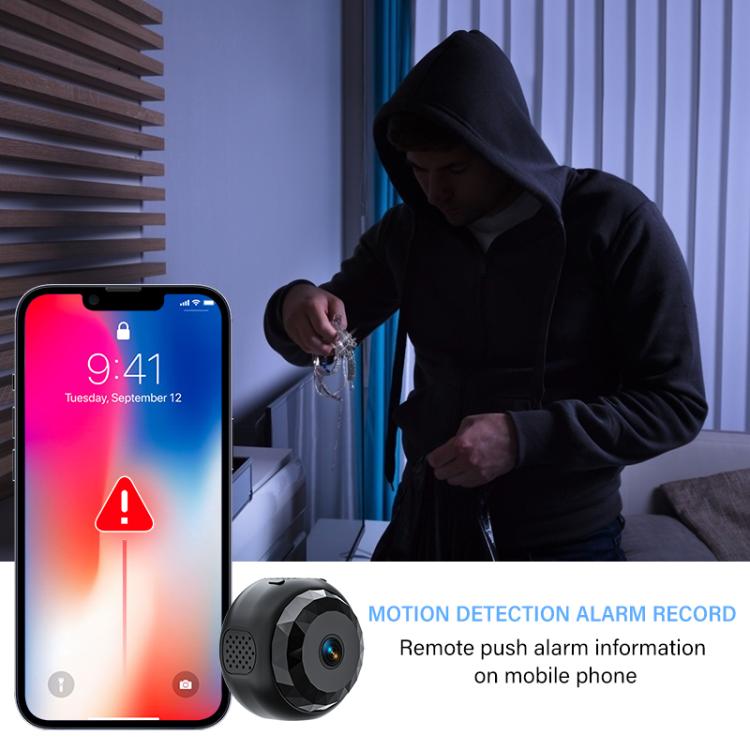 Mini security camera near a doorway with smartphone motion alert