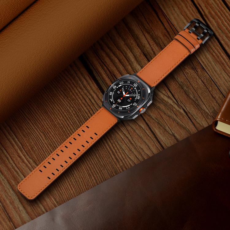 Orange leather watch band with adjustment holes and buckle, attached to a smartwatch.