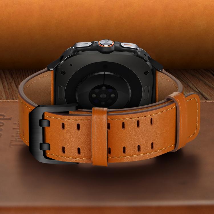 Back view of an orange leather watch band with perforations and a black buckle