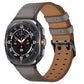 Gray leather watch band with brown lining and two keepers, shown on a smartwatch.