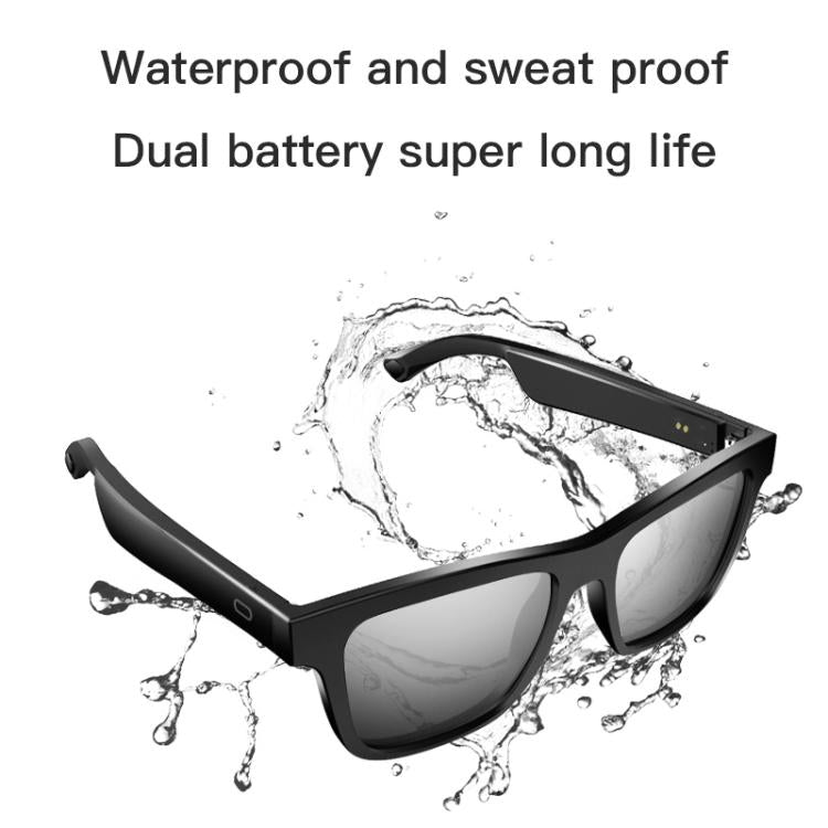 Black smart audio glasses with dark lenses, shown at an angle amid splashing water.