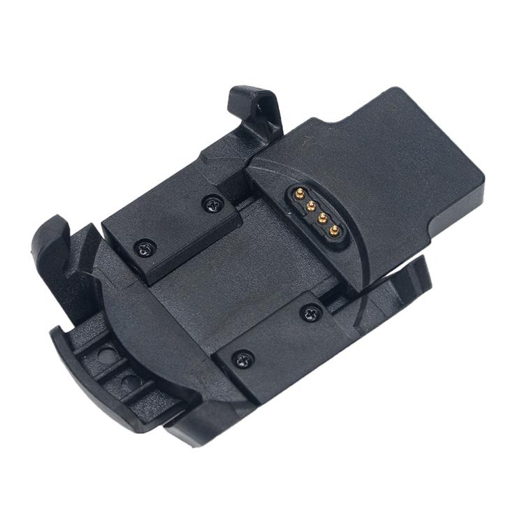 Close-up of the black charging base with four gold charging contacts