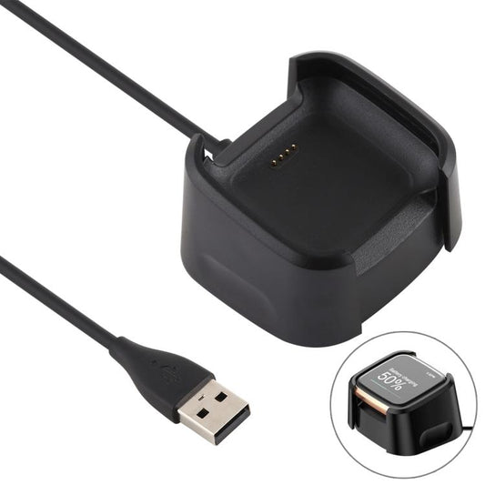 Black Fitbit Versa 2 charging dock with attached USB-A cable and watch shown charging