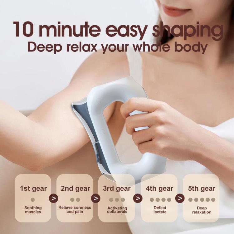 White electric heating massage blade held in hand during fascia massage
