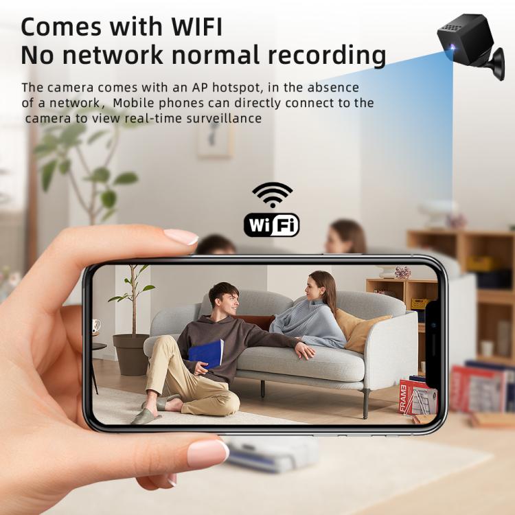 WiFi mini security camera with smartphone displaying live video from the camera
