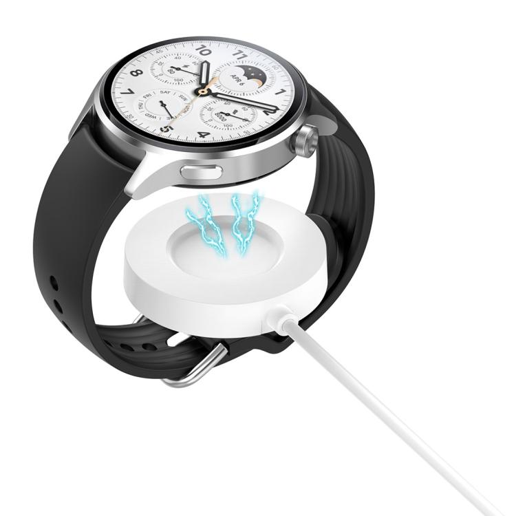xDfind magnetic charger attached to a silver smartwatch with a black strap