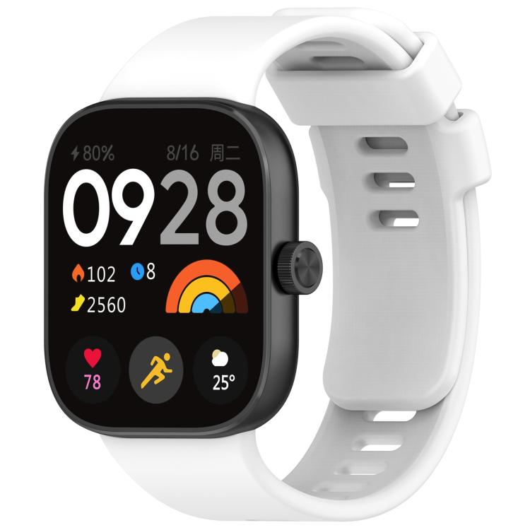 White silicone sports watch band fitted to a black smartwatch, with buckle and adjustment holes.
