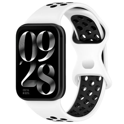 White and black perforated silicone watch band with smartwatch