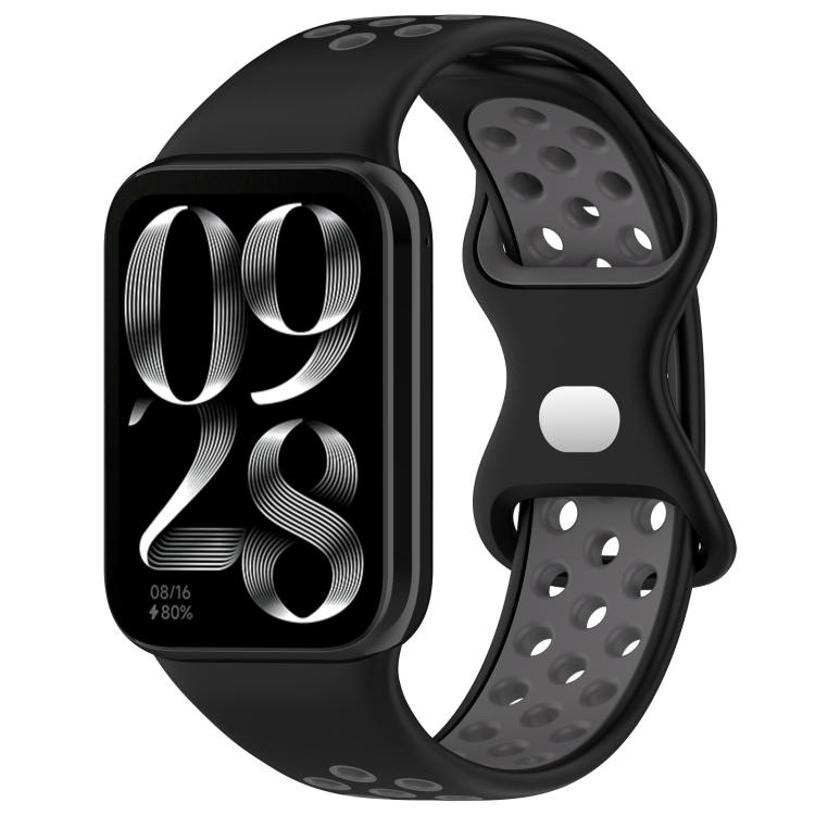 Black and gray perforated silicone watch band with smartwatch