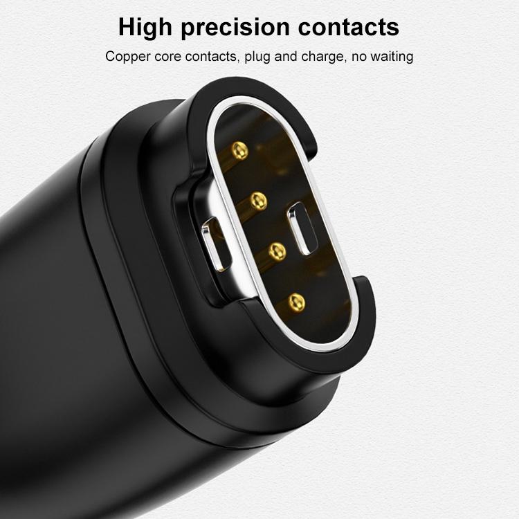Close-up of the xDfind adapter's four gold charging contacts.